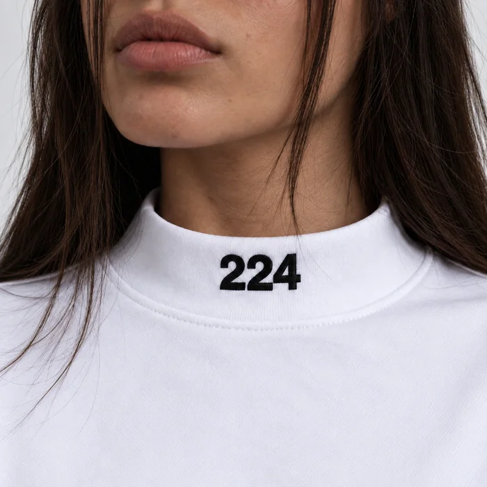 Close view of a white T-shirt collar and fabric.