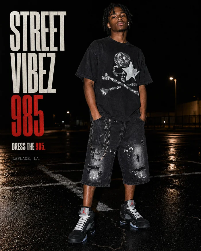 Editorial poster featuring a black graphic T-shirt.